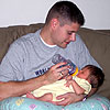 Dad is feeding me my very first bottle.<br><div class='photoDatesPopup'><br>from Emily's Photos taken 6/19/2005 and posted 6/28/2005</div>