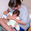 Mom is giving me a baby manicure while I suck on her wrist.<br><div class='photoDatesPopup'><br>from Emily's Photos taken 8/23/2005 and posted 8/27/2005</div>