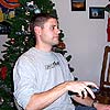 Apparently I'm playing with a DVD while family is over my house.  My priorities are just fine, thank you.<br><div class='photoDatesPopup'><br>from David's Photos taken 1/1/2004 and posted 12/27/2005</div>
