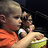 Emo's second trip to the movies went much better.  He can really slam some popcorn.  I think he ate most of that popcorn by himself and halfway through the movie asked for more.<br><div class='photoDatesPopup'><br>from Emerson's Photos taken 7/16/2016 and posted 11/1/2016</div>