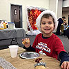 Enjoying a donut at the Christmas breakfast at preschool.<br><div class='photoDatesPopup'><br>from Emerson's Photos taken 12/9/2017 and posted 2/28/2018</div>