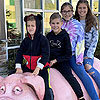 4 kids on a pig.<br><div class='photoDatesPopup'><br>from Elise's Photos taken 10/20/2020 and posted 11/19/2020</div>